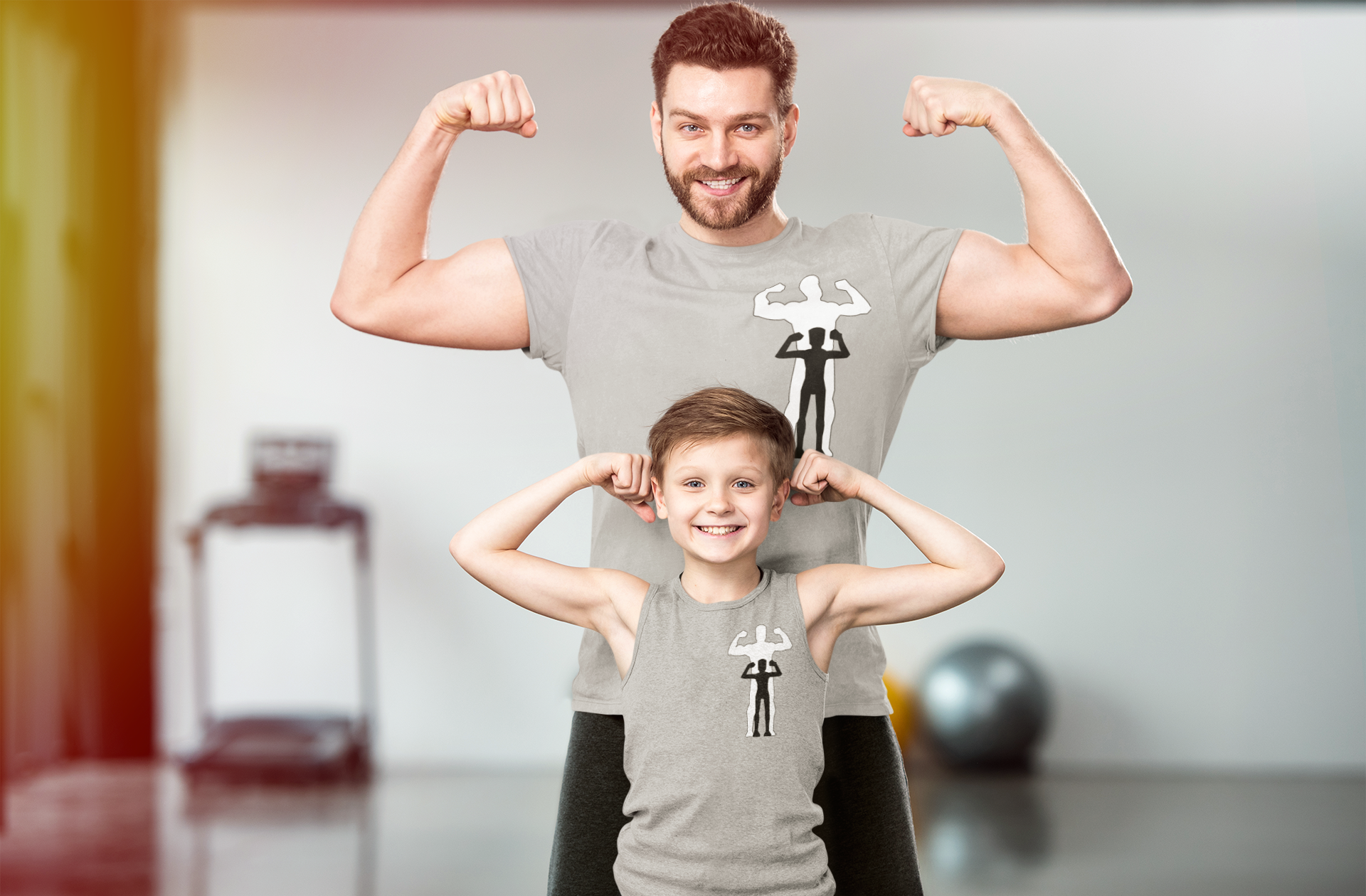 Adult man and kid in workout room flexing their arms